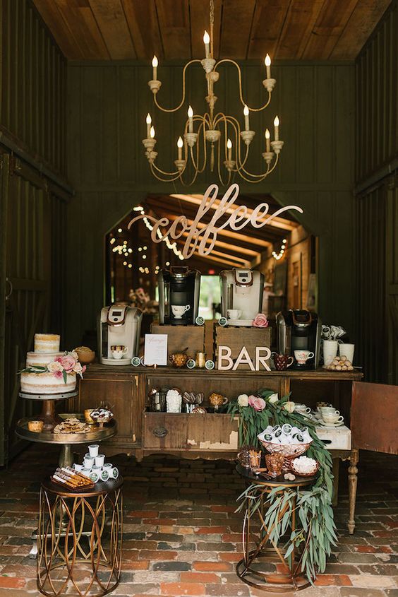 Coffee bar set up with gold chandelier hanging from ceiling.