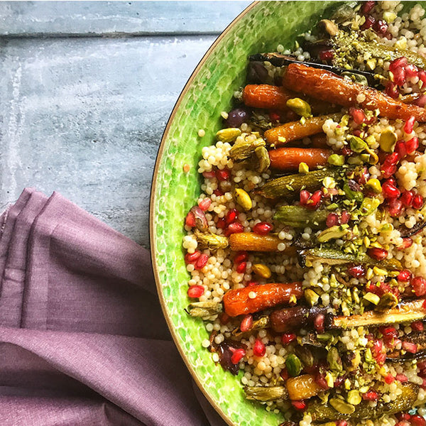 Top view of Autumnal Roasted Veg & Pearl Couscous With Crushed Pistachio Salad.