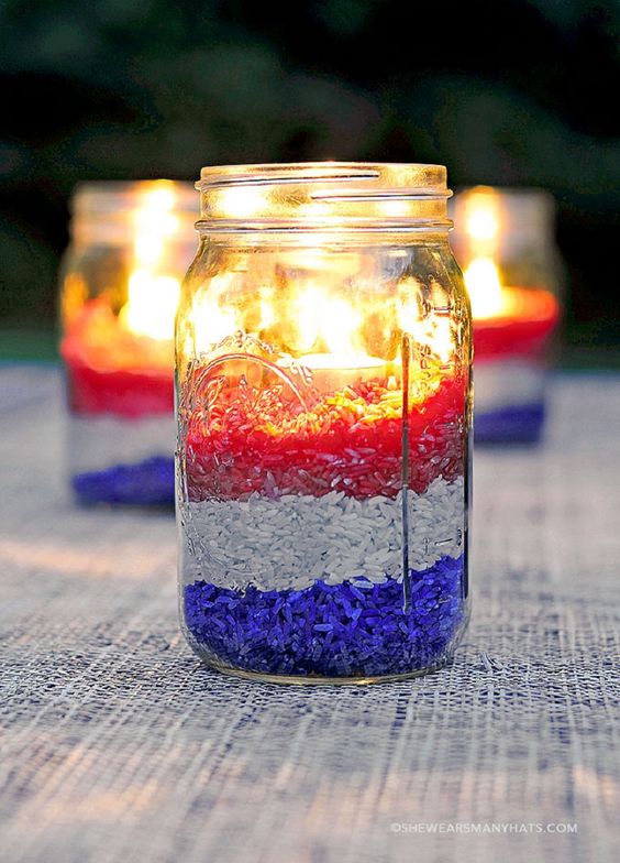 Mason jar filled with red, white and blue candle.
