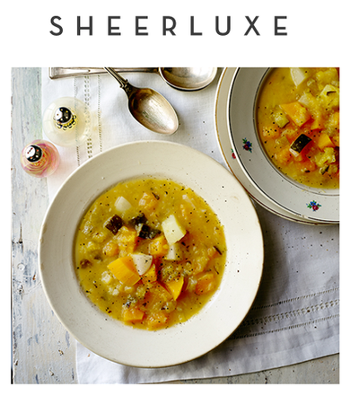 Top text: Sheerluxe. Top view of white bowls filled with soup on top of white tablecloth. 