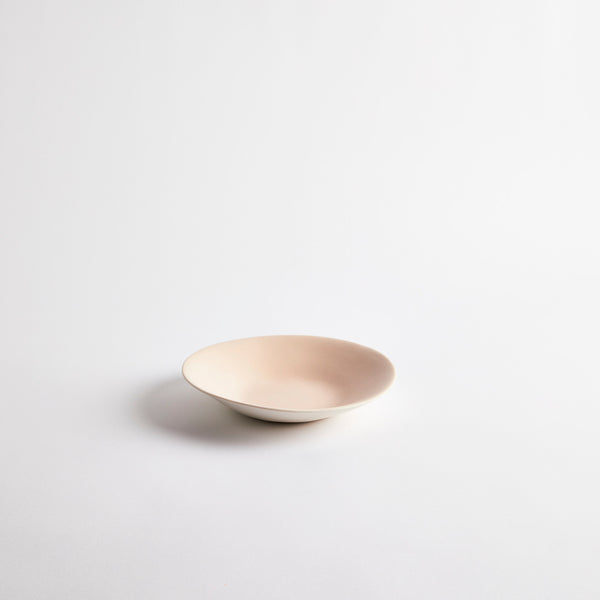 White with pale pink interior ceramic shallow bowl.