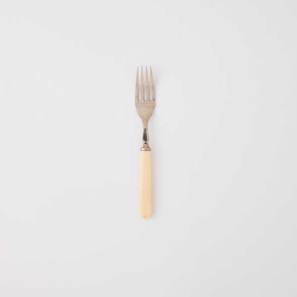 Silver fork with cream handle. 