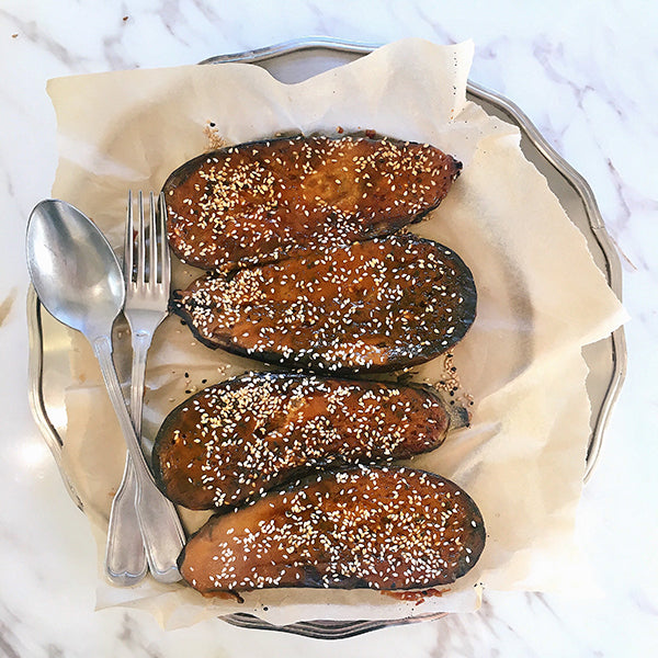 Top view of Honey Glazed Miso Aubergine in a dish. 