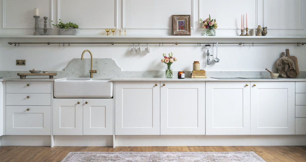white shaker kitchen with brushed brass tap and handles