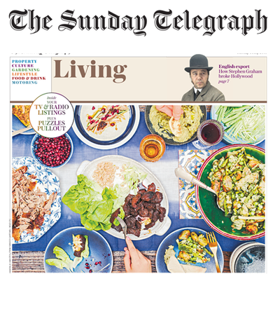 Top text: The Sunday Telegraph. Photo of digital newspaper of table setting with food. 