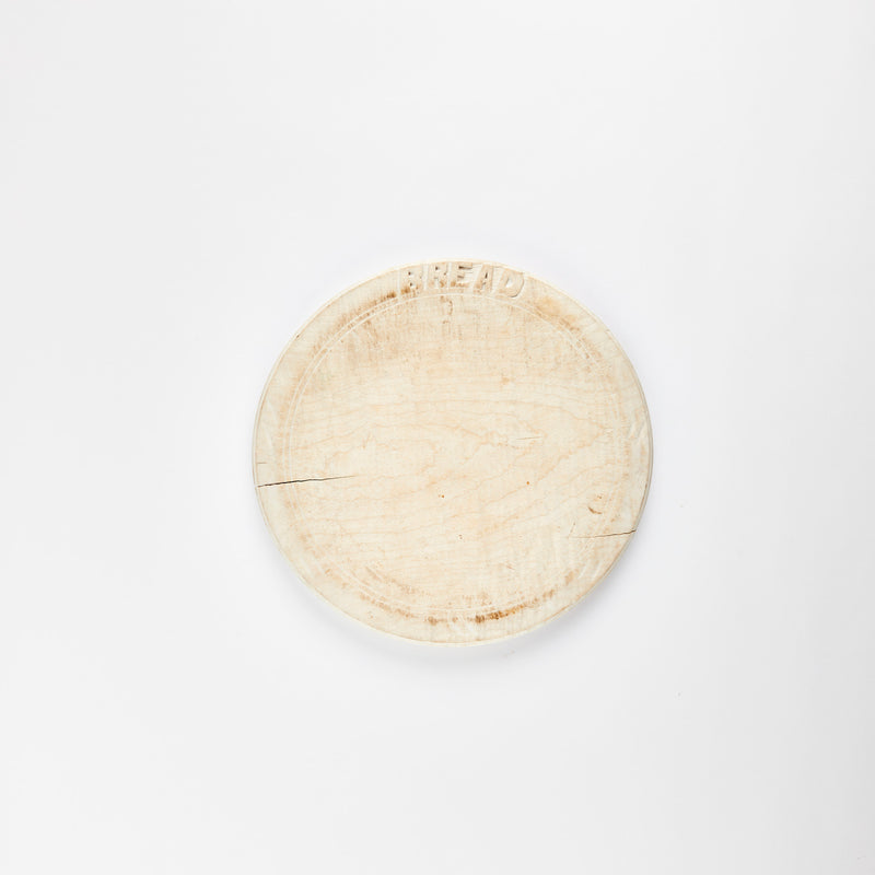 Bleached circular wooden board.