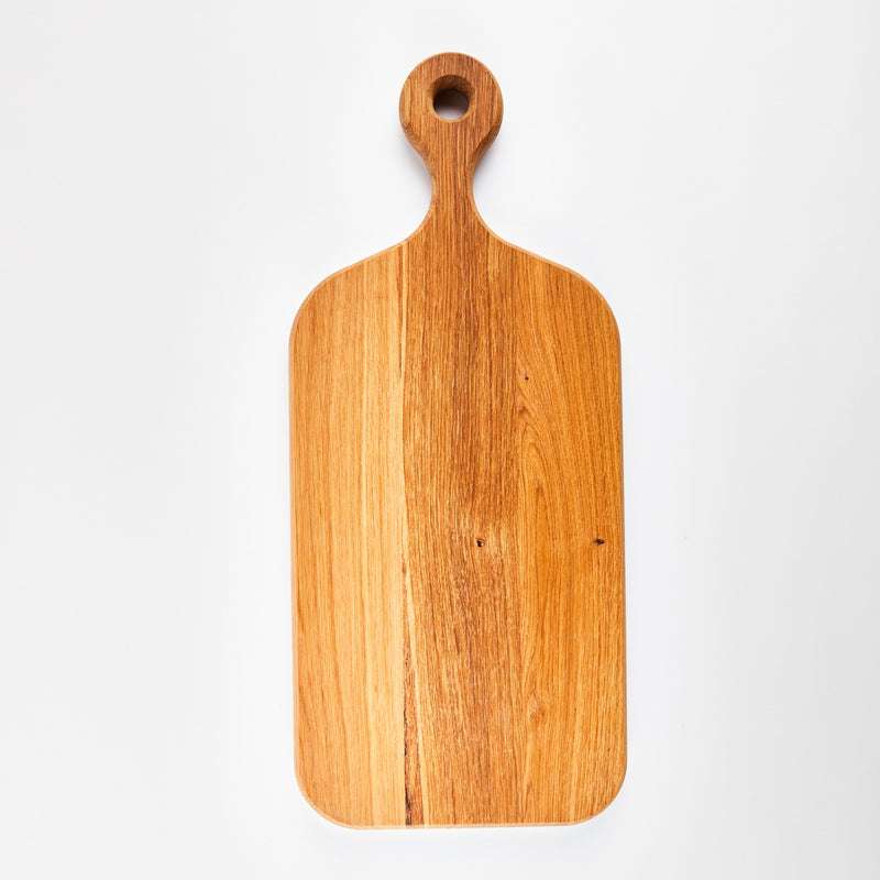 Wooden rectangular board with handle.