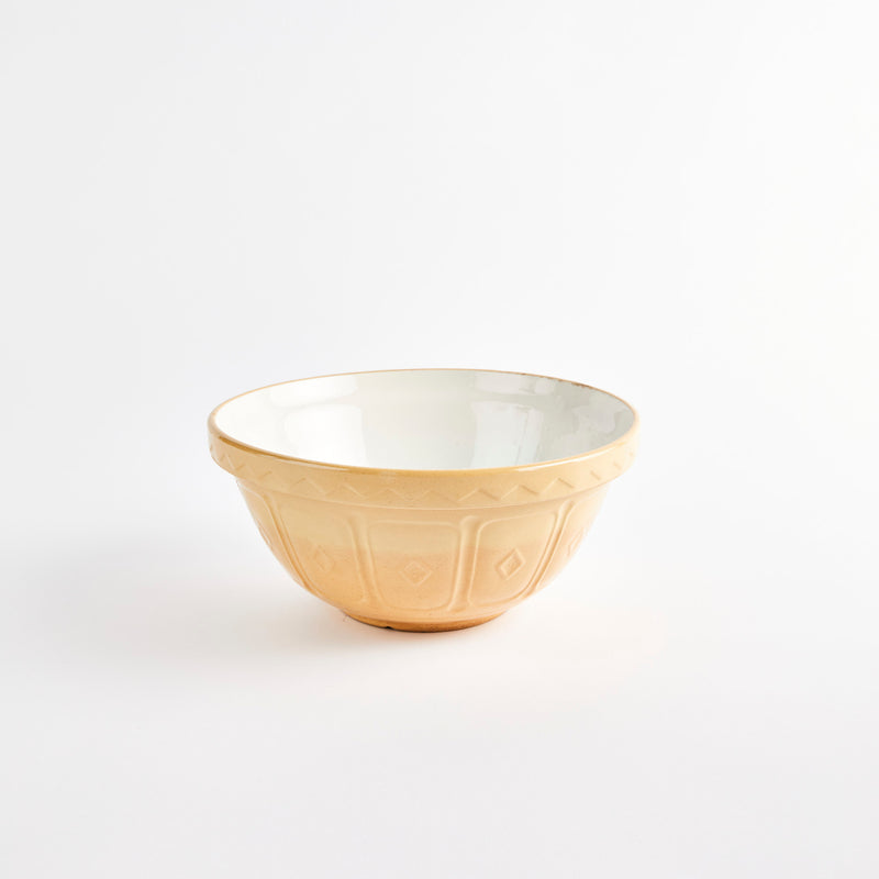 Large beige bowl with white interior.