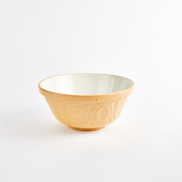 Large beige bowl with white interior.