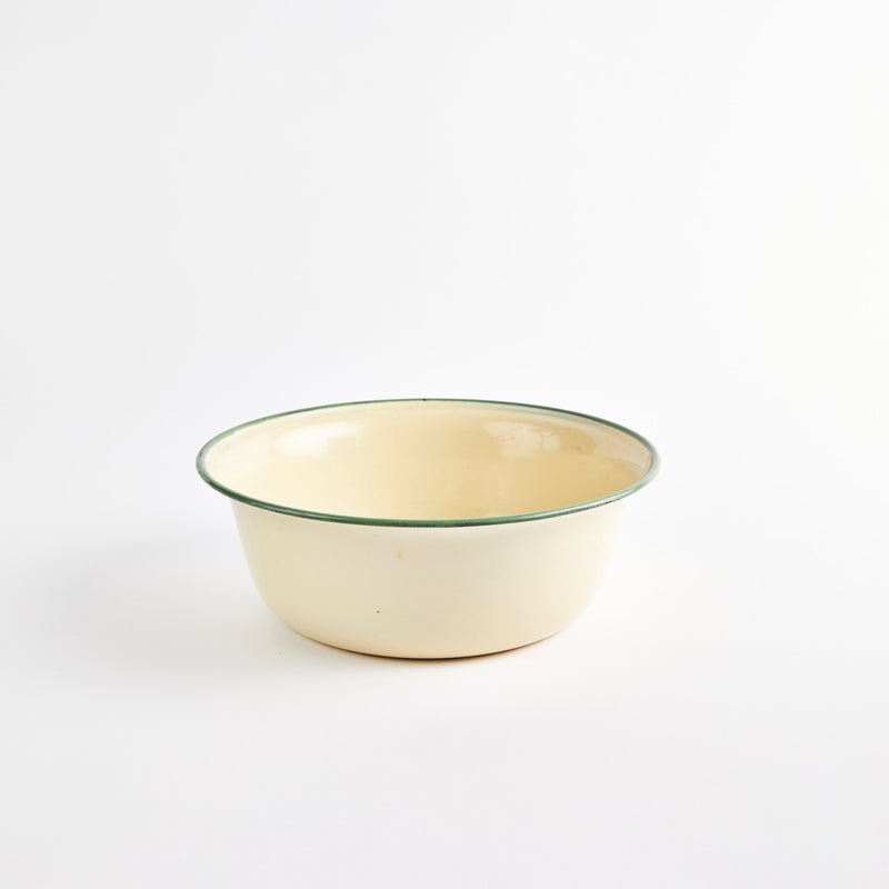 Beige bowl with green rim.