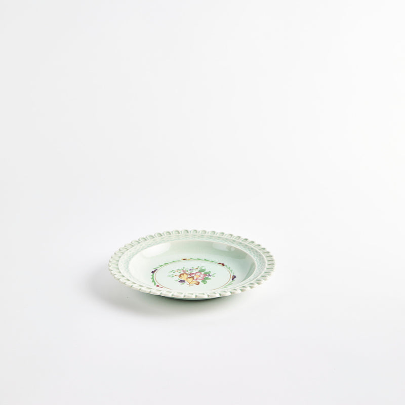 Green bowl with floral pattern. 