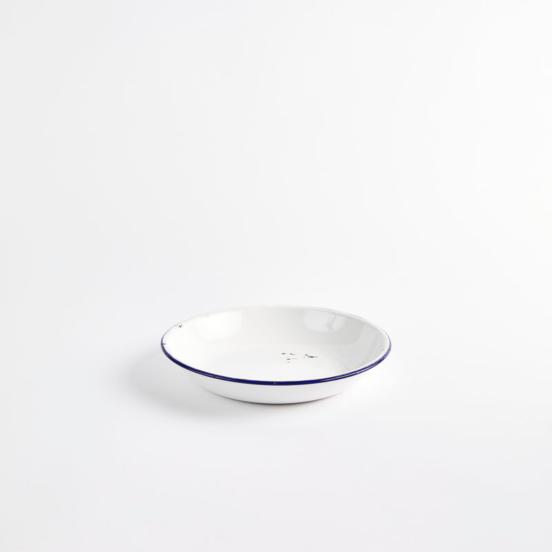 White bowl with blue rim.