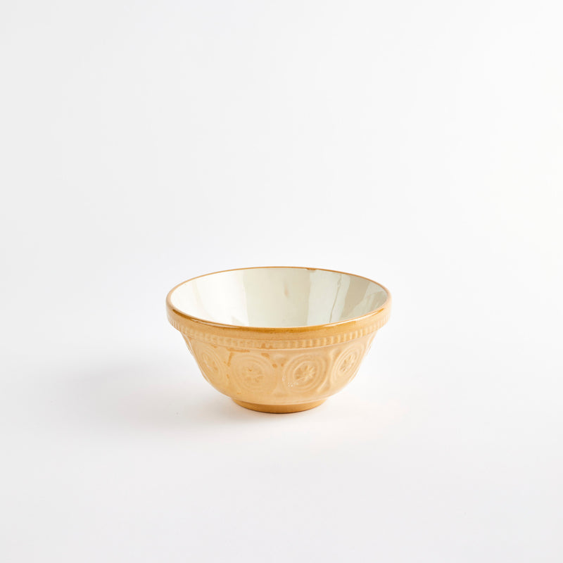 Beige embossed design bowl with white interior. 