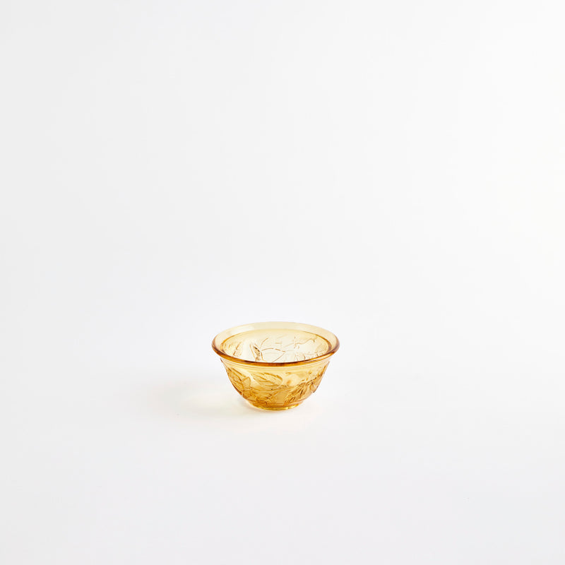 Brown glass bowl with embossed design.