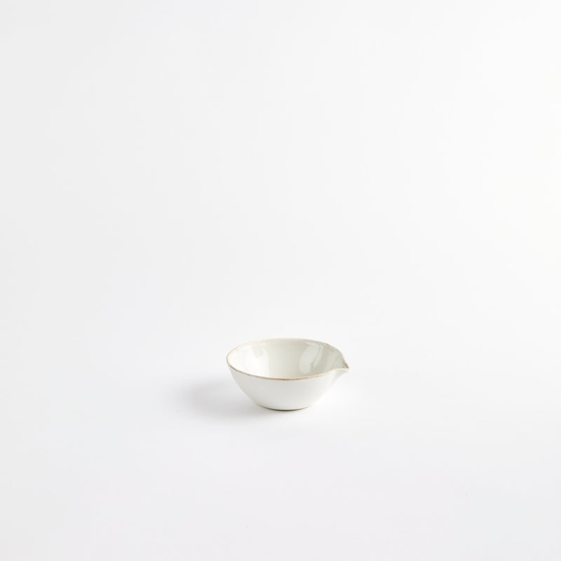 White bowl with spout.