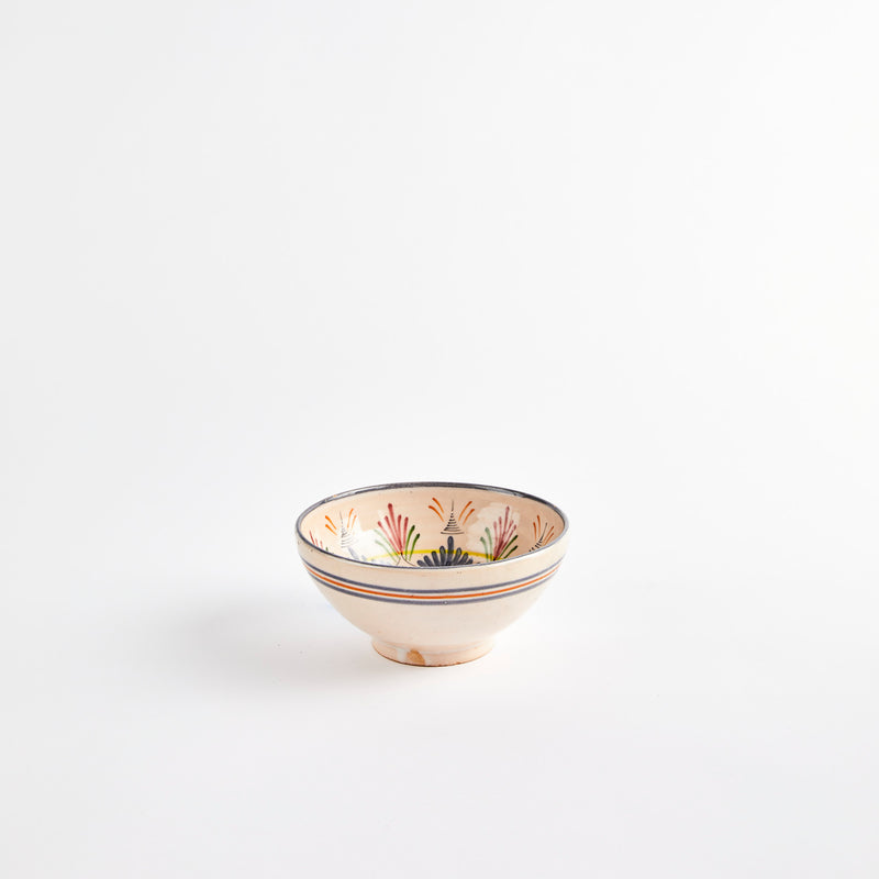 Light pink bowl with intricate design interior. 