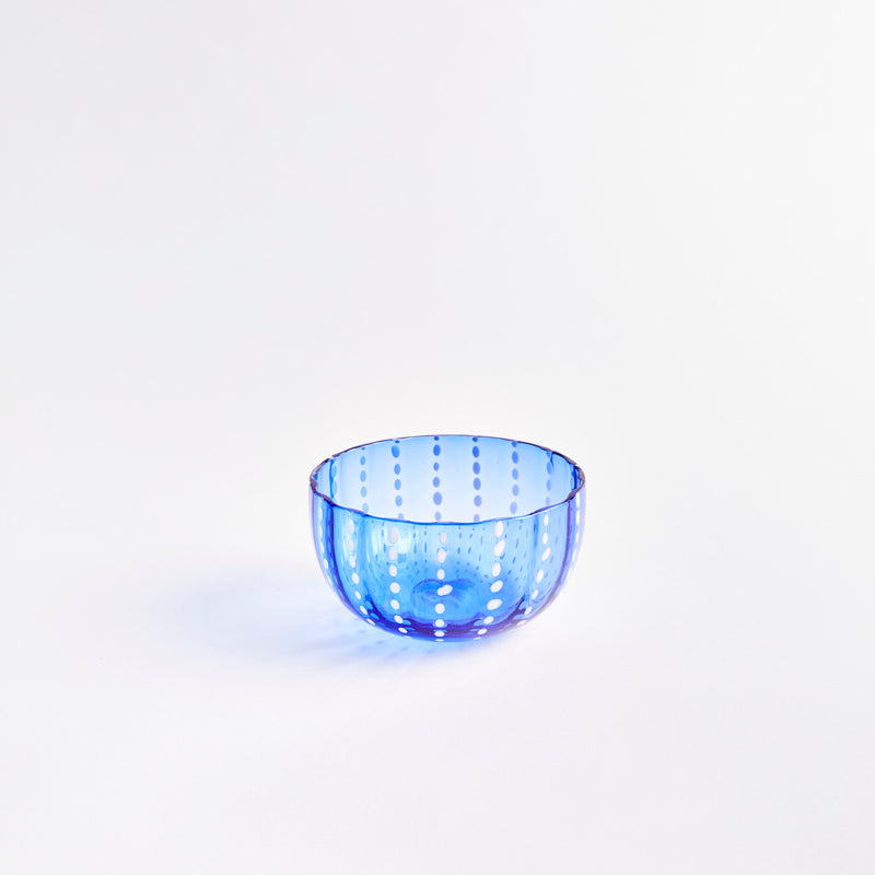 Navy blue glass bowl with white dots.