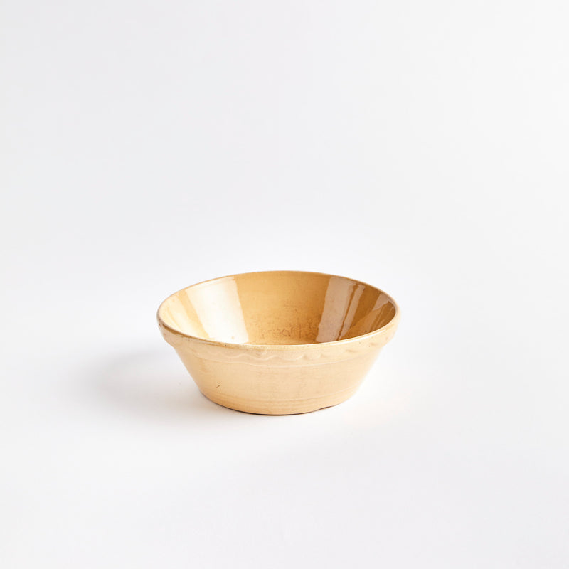Light brown ceramic bowl.