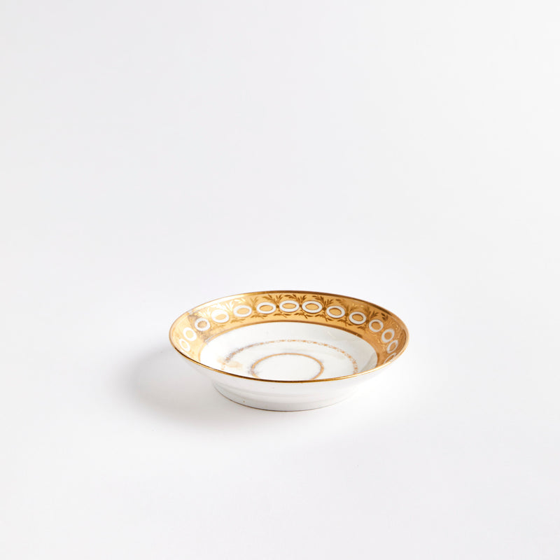 White china bowl with gold detail design.