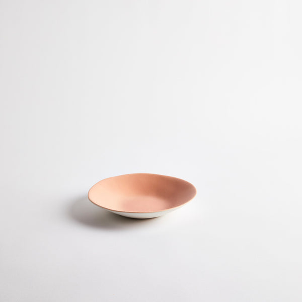 White with pink interior ceramic shallow bowl.