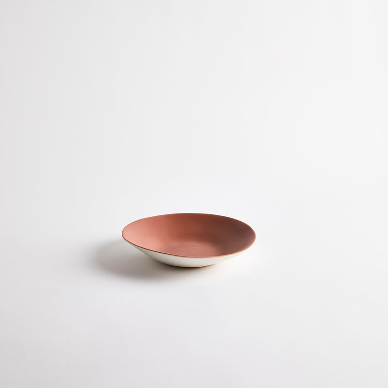 White with pink interior ceramic shallow bowl.