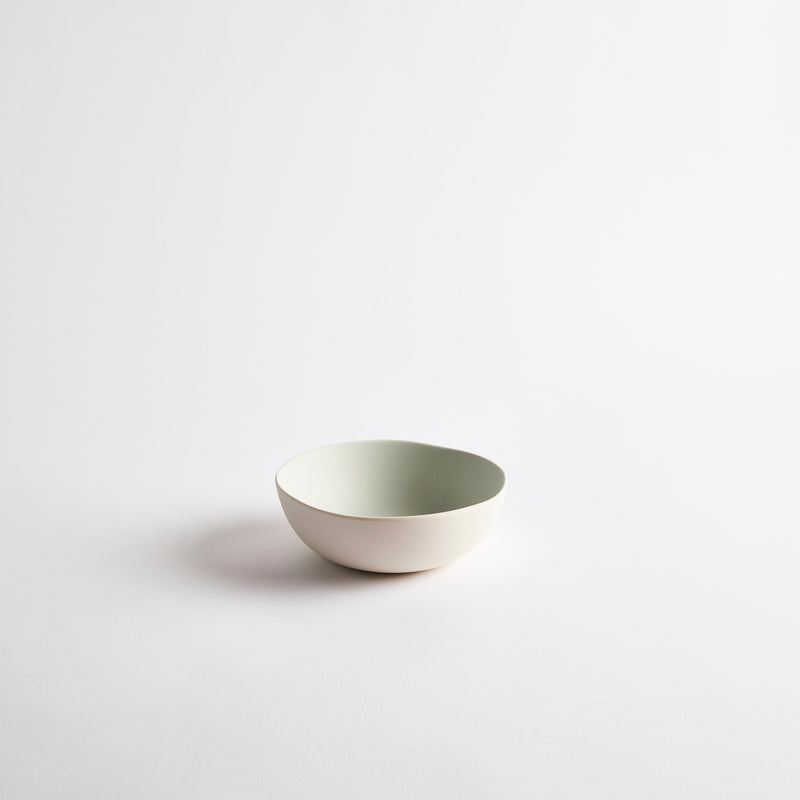 White with pale blue interior ceramic bowl.