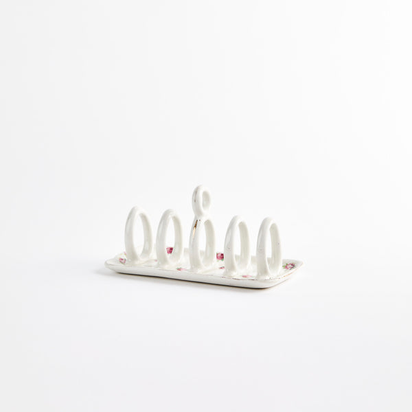 White with pink rose bud design ceramic toast rack.