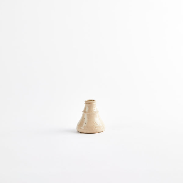 Cream ceramic candle holder.