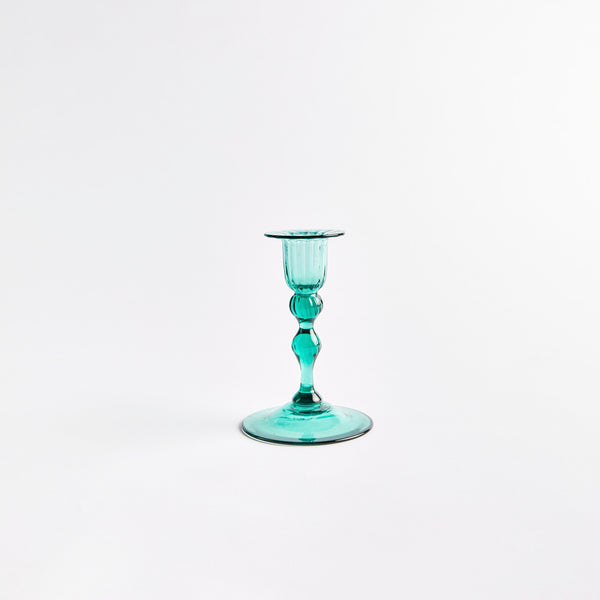 Green glass candle holder.