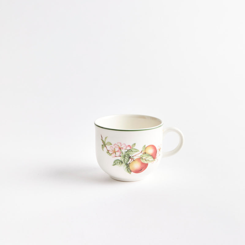 White coffee cup with mango design.