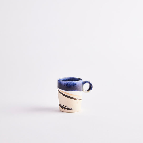Cream and blue coffee cup.