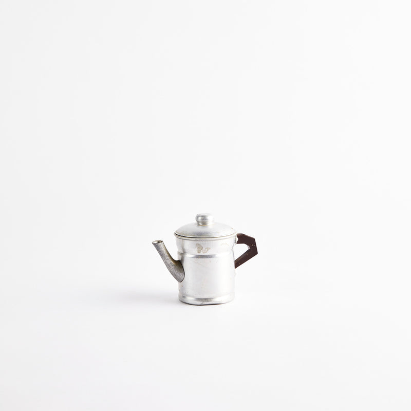 Silver coffee pot.