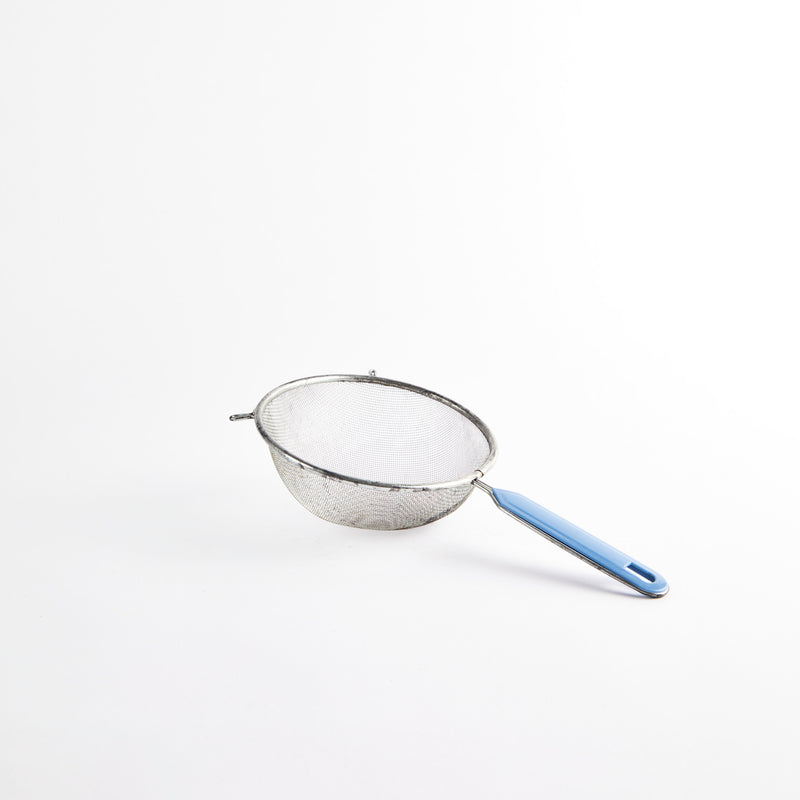 Silver metal sieve with blue handle.