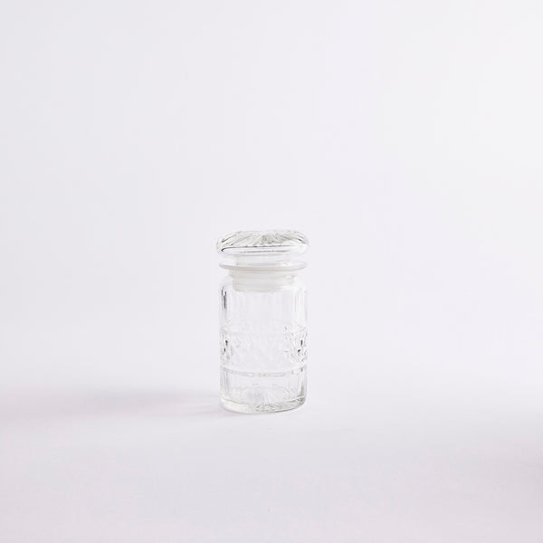 Clear glass jar with lid.