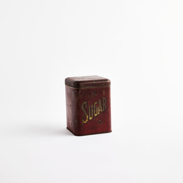 Burgundy sugar container.