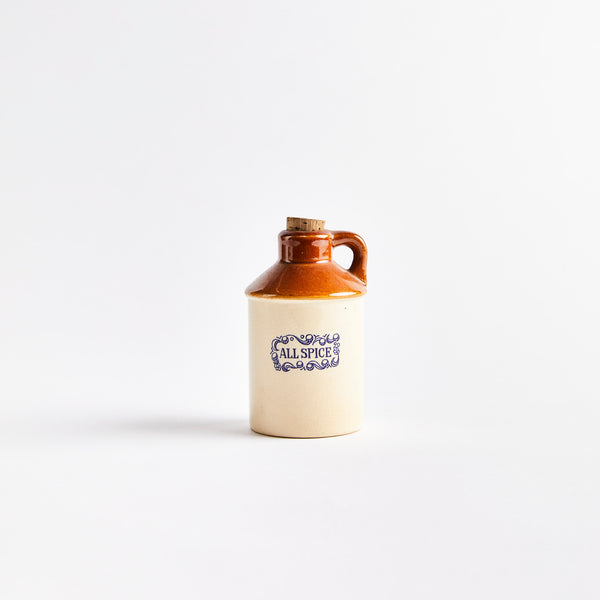 Beige and brown ceramic container with "All Spice" in blue text.