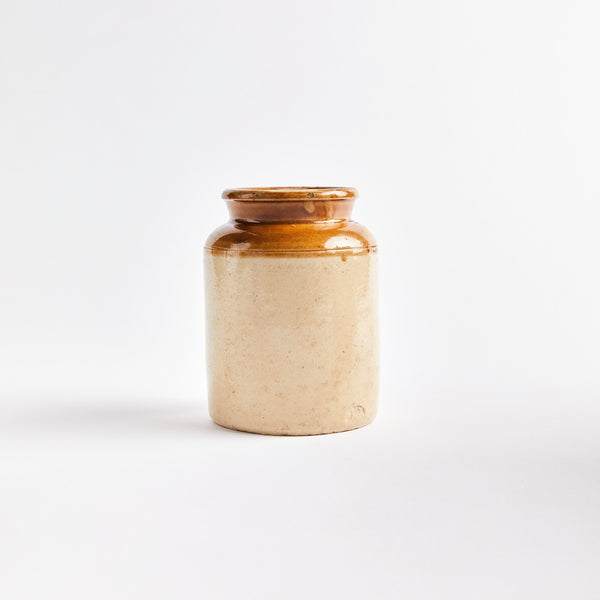 Beige and brown ceramic kitchen container.