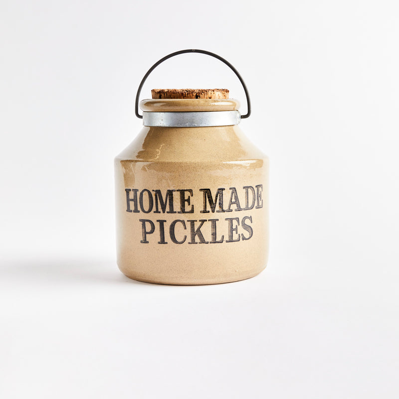 Beige ceramic container with "Home Made Pickles" in black text.