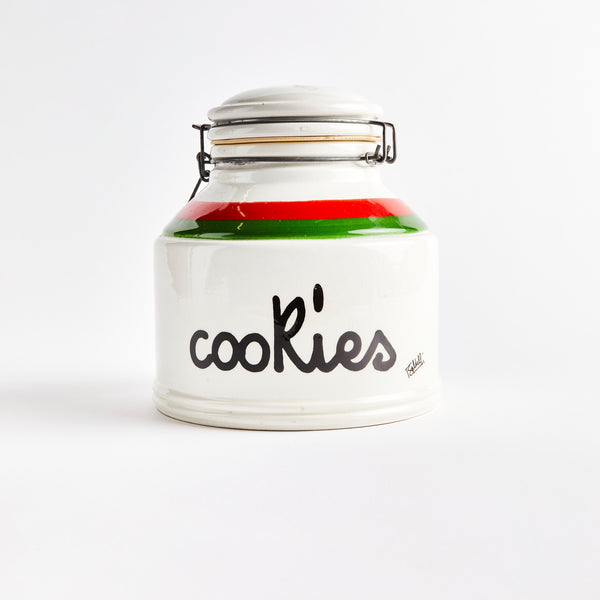 White ceramic cookie jar with a green and red stripe.