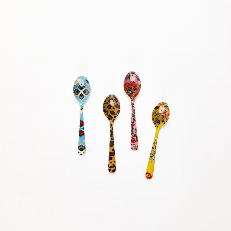 Four multicoloured design teaspoons.