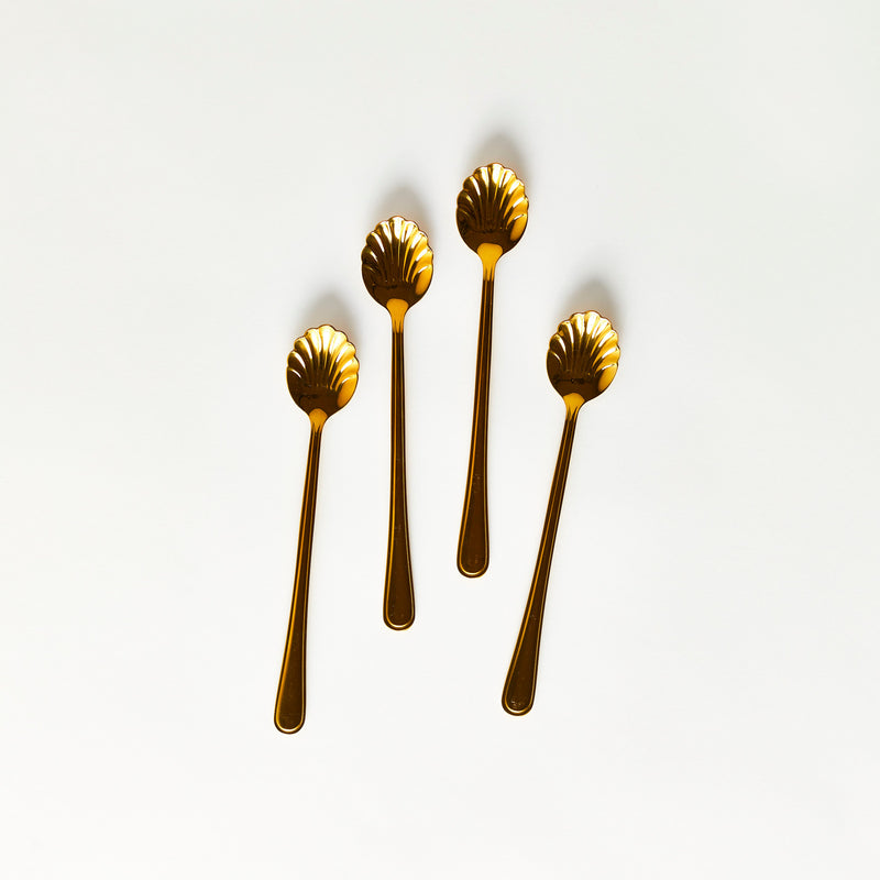 Four gold scalloped edge spoons with long handle.