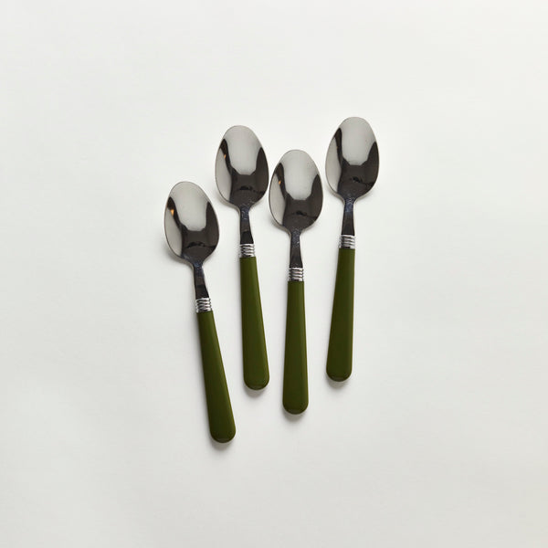 Four silver spoons with green handle.