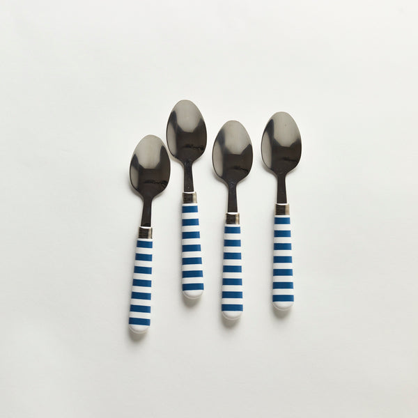 Four silver spoons with white and blue striped handle.