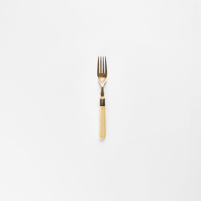 Silver fork with bone handle.