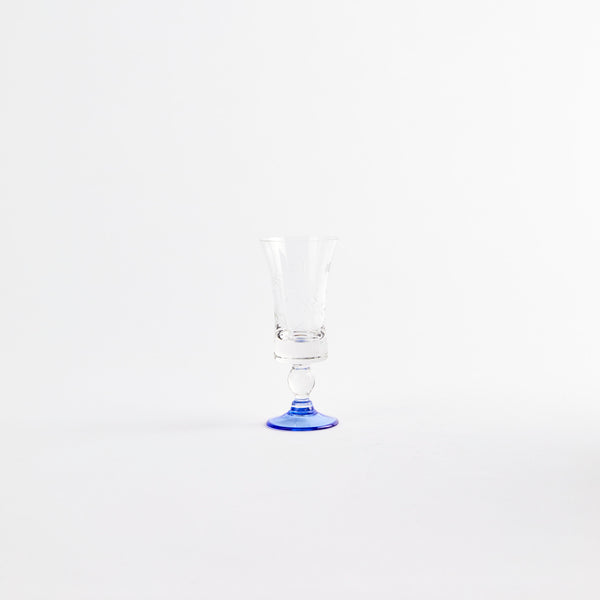 Clear floral etching glass cup with a blue base.