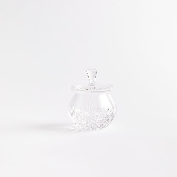 Clear vintage glass honey pot with etched design.