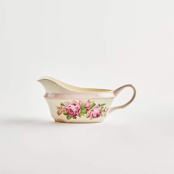 Cream with multi flower design ceramic jug.