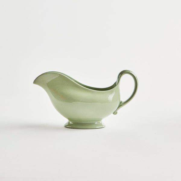 Green ceramic pouring jug.