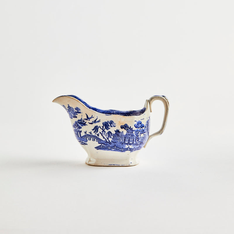 White ceramic jug with blue design.