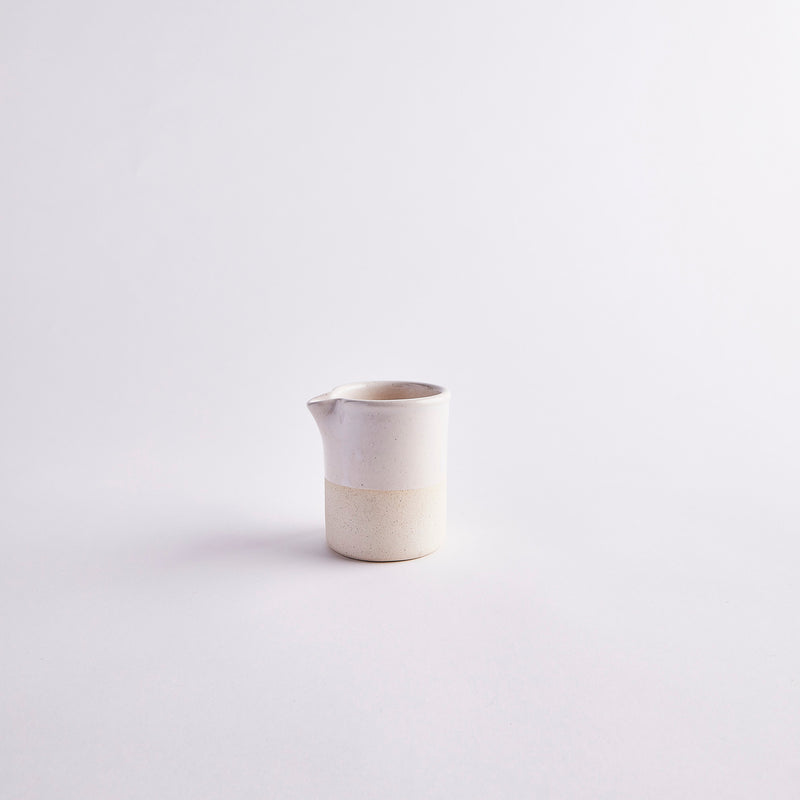 Cream ceramic jug.